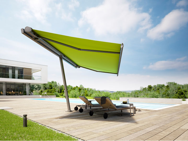 Image of freestanding planet fitted with retractable awning providing shade next to a garden swimming pool>